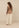 Gilet Aalya Beige met Top Jaz taupe en Broek Kavi sand, achterkant